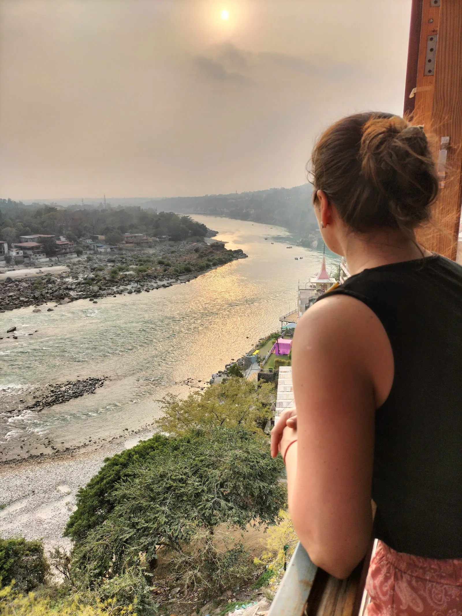 Contemplating the Ganges river in Rishikesh, India